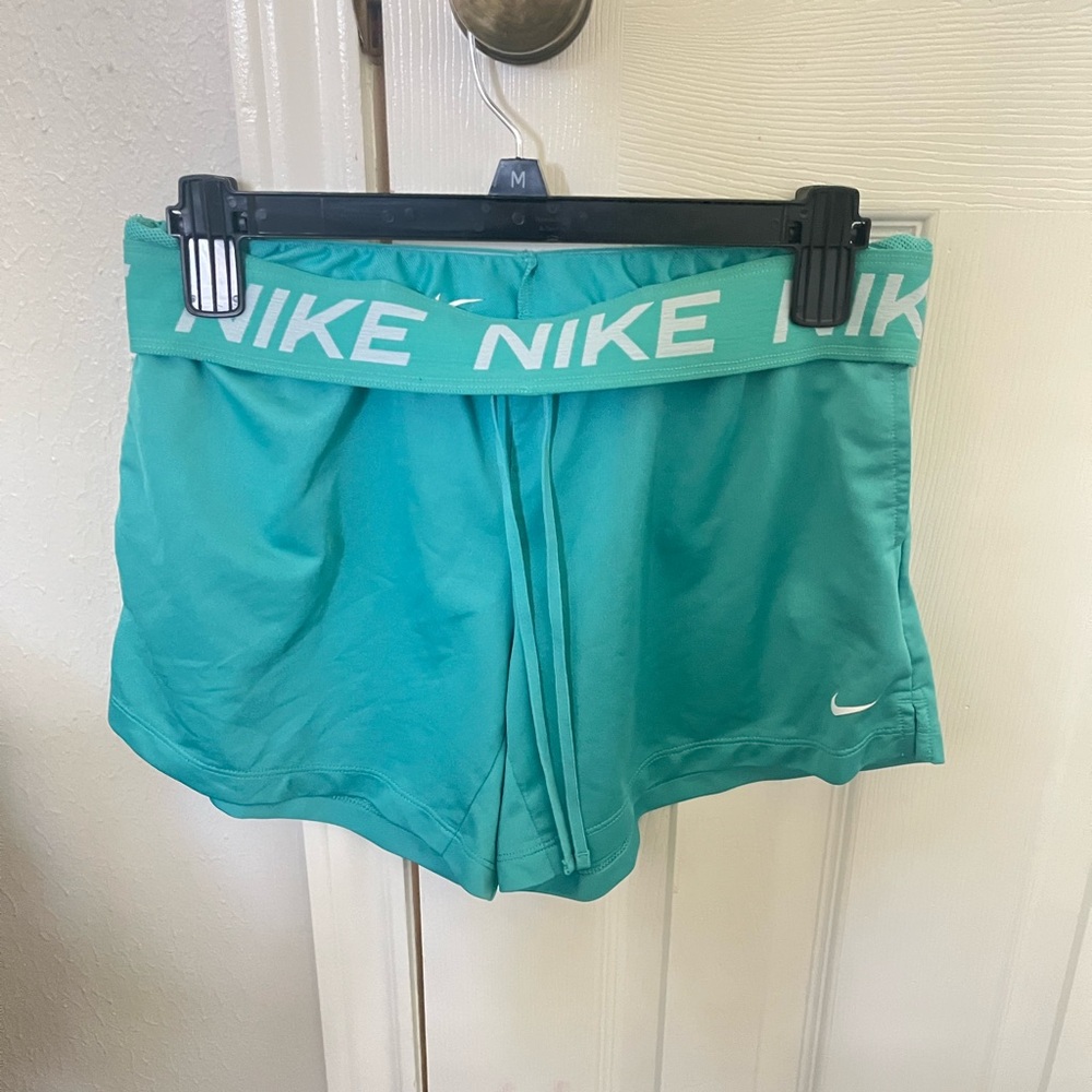 Women’s Nike Attack Dri-FIT shorts in teal green.